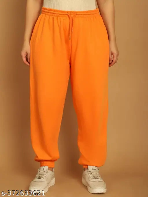Orange nylon solid jogger pants with elastic waistline and drawstring detail, made by NOBARR, ankle length, unlined, straight hemline, in large size. Made of 65% polyester, 35% cotton