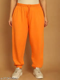 Orange nylon solid jogger pants with elastic waistline and drawstring detail, made by NOBARR, ankle length, unlined, straight hemline, in large size. Made of 65% polyester, 35% cotton