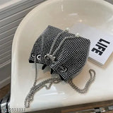 Black and white rhinestone bucket bag with pearl chain crossbody strap