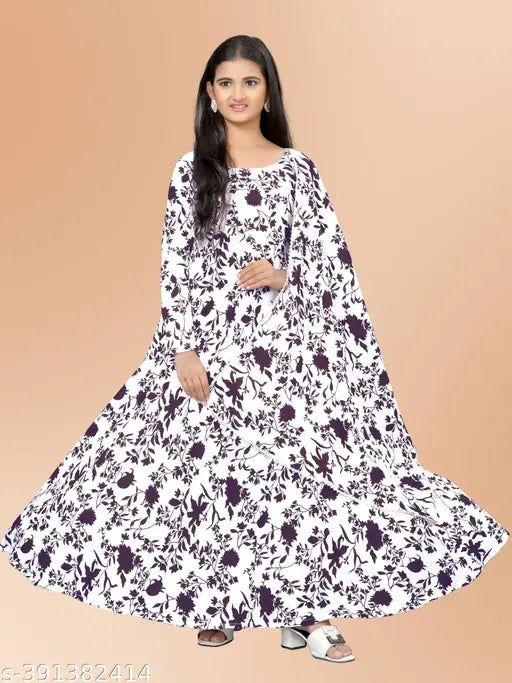 Kids maxi gown with dupatta, printed floral design on polycotton. Classic round neck and long sleeves, intricate lacework details. Great for special occasions or festivals