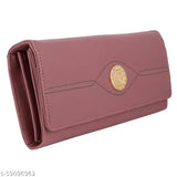Pink leather clutch with zip closure and round embellishment