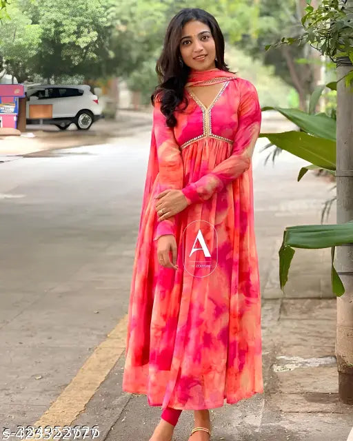 Pink georgette gown with long sleeves and flared skirt
