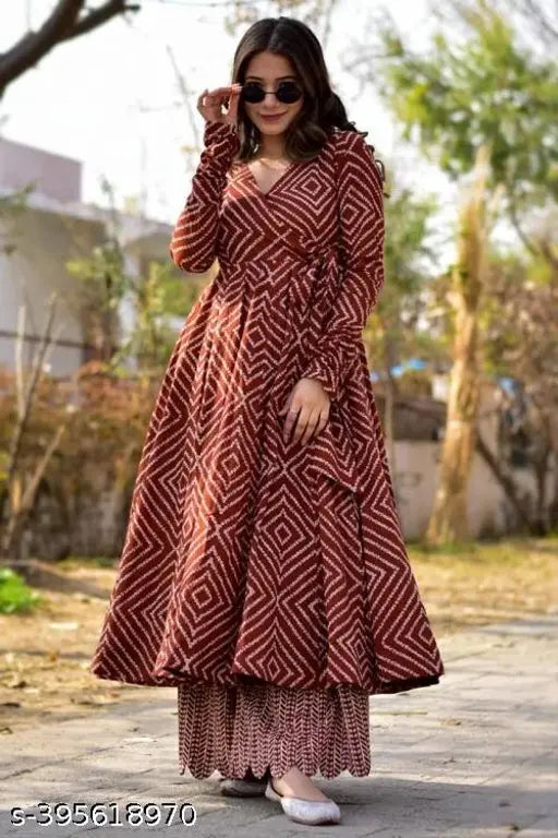 Rayon maroon kurta set with palazzos, printed net pattern on display. Single size options from S to XXXL. Indian ethnic wear trending