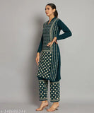 Woolen MEAVYIL Kurta set with palazzo bottoms, featuring three-quarter sleeves and printed net pattern. Women's Indian wear." (124 characters)