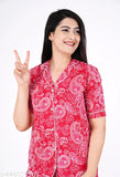 Women's printed rayon night suit top and pajama set, short-sleeved, vibrant pattern on display