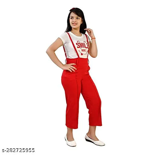 A girl in a red dungaree dress set