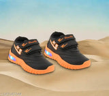 Black and orange kids' led sneakers with velcro closure, featuring bright light-up soles and a sporty design