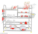 Stainless steel wall mount kitchen rack with five shelves, holding various dishes, cutlery, and utensils