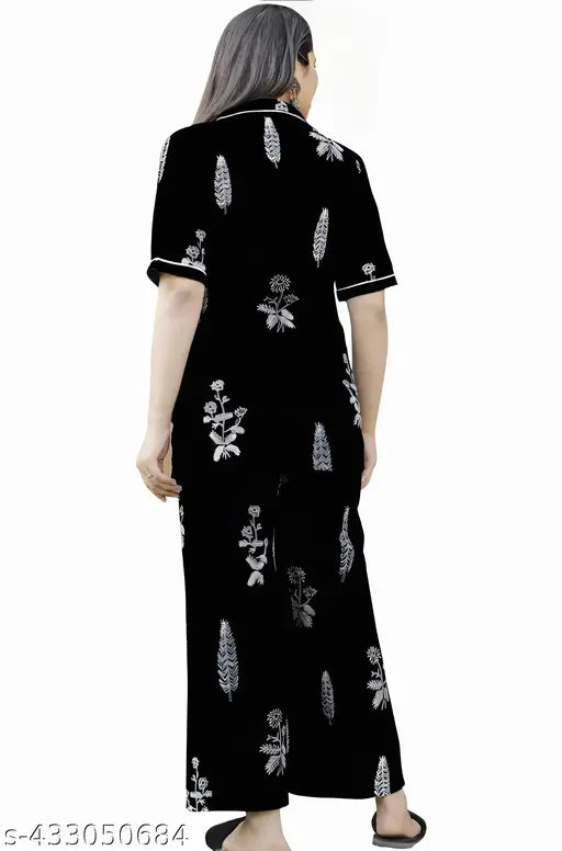 Black cotton nightsuit set for women, featuring printed design, short sleeves, and pyjama bottoms. Ideal for comfortable sleepwear and loungewear. Handcrafted in India