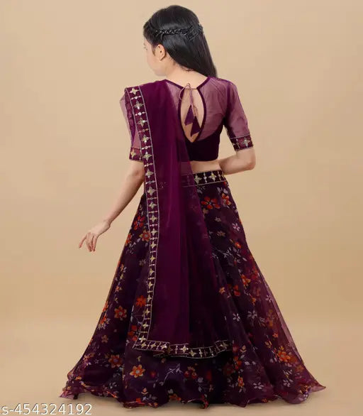 Pink organza lehenga cholis for girls, embroidered floral stitch on art silk top with three-quarter sleeves. Indian kids' fashion accessory." (108 characters)