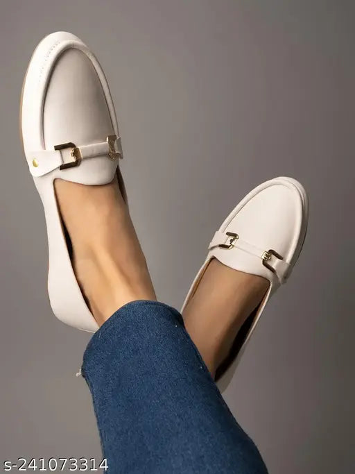 Synthetic, slip-on white bellies with golden metal buckle for women & girls - stylish casual footwear on a soft surface, ready to offer comfort and confidence