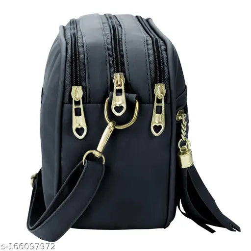 Black sling bag with multiple compartments, adjustable strap and shoulder pad