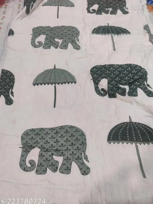 Single quilt with elephant motifs, likely cotton or polyester blend