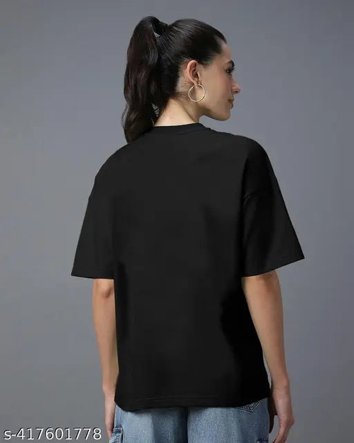 A printed graphic t-shirt in a solid dark color, featuring a bold pattern on a lighter background, with short sleeves and a round neckline