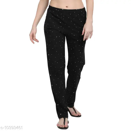 Attractive woman wearing black pajama pants with polka dots