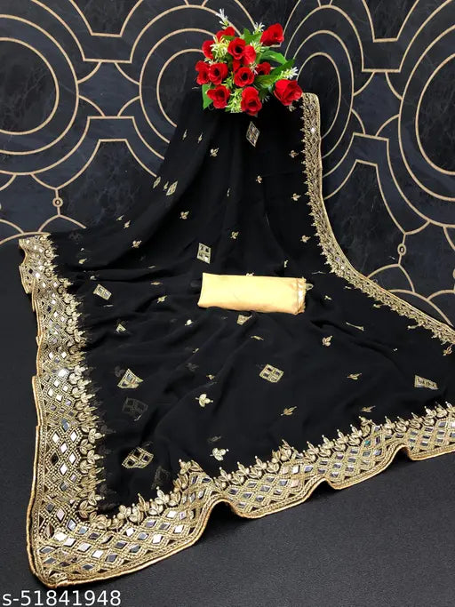 Gold heavy saree with embroidered floral work, velvet lace, and a presentative bow on top