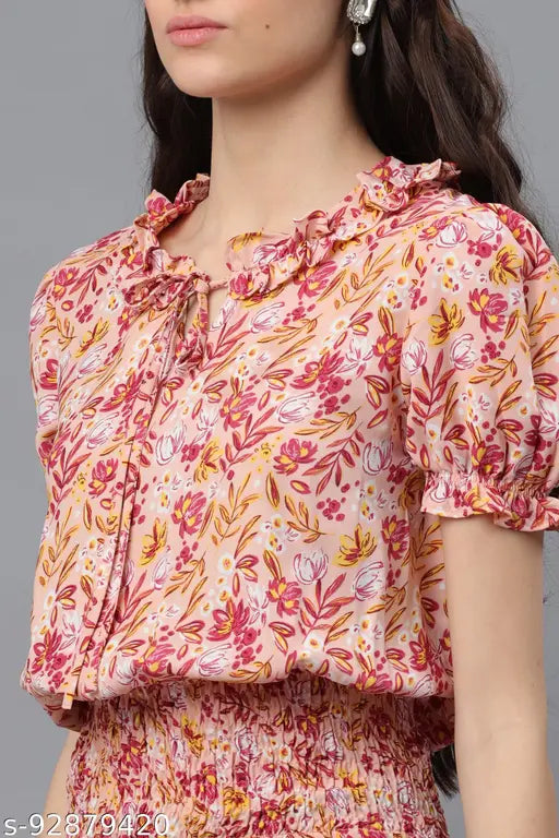 Pink printed polyester top with casual puff sleeves, short sleeve length. Women's size M, XS-XXXL. Made in India