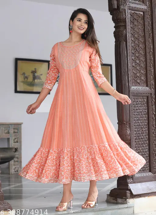 Peach rayon floral embroidered Anarkali Kurta, traditional Indian ethnic wear with sequins, beads, tassels, and side slits