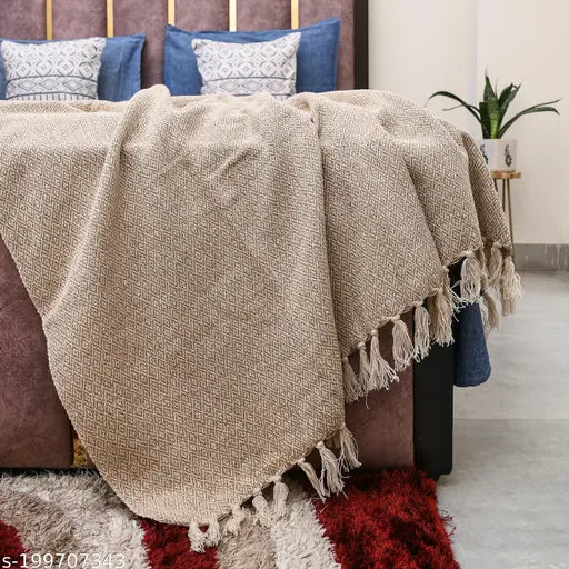 Beige breathable cotton throw (150cm x 125cm, 60 x 50 inch), geometric design with tassels. 100% soft cotton for comfort at home or travel
