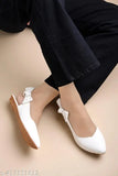 White synthetic flat belly ballerinas by Shoetopia, featuring a casual side bow design. Comfortable and stylish for women & girls