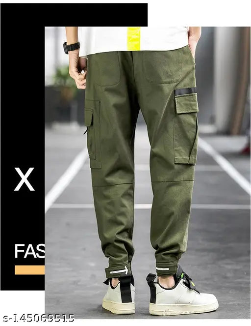 Men's cargo pants with a green flap pocket and zip details, featuring drawstrings at the waist