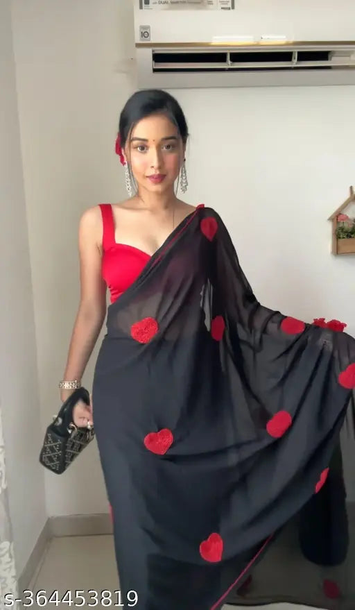 Black georgette saree with red border and black blouse