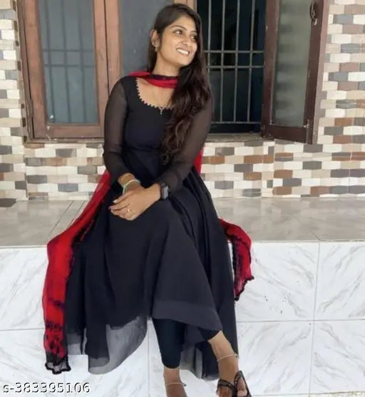 Black party dress with long sleeves, deep neckline, red dupatta