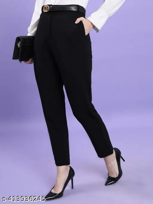 Black formal pants for women in office setting, as seen in fashion magazine
