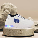 Prattle Foot Kids Led Shoes, lightweight athletic shoes with blue velcro closures and built-in LED lights