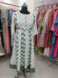 White and blue printed kameez with dupatta on a hanger in a shop