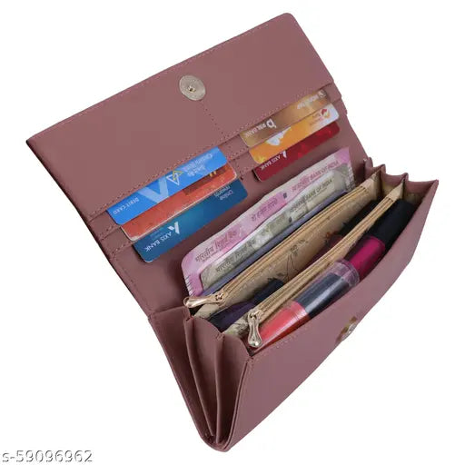 A trendy woman's clutch with multiple card slots, styled in a dark pink leather with zip closure and a clear card pocket