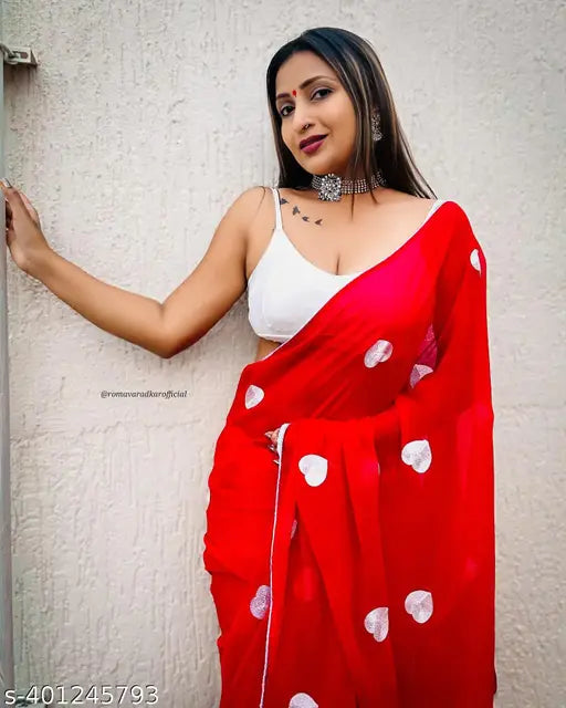 Red and white traditional sari with embroidered patterns