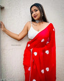 Red and white traditional sari with embroidered patterns