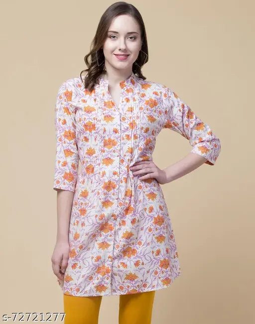 Pink rayon floral top and tunic with 3/4 sleeves, mandarin collar, and wait belt, featuring a printed net pattern. Approx length: 34". India origin