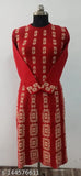 Red and gold embroidered dress with long sleeves, knee length, fitted bodice