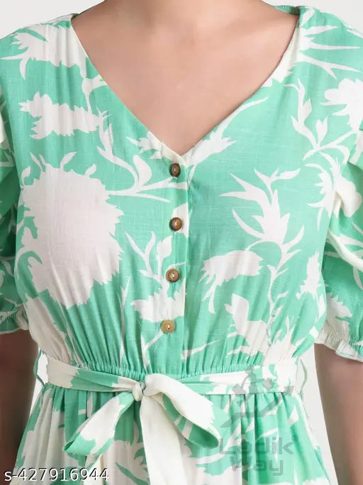 Cotton blend pista printed long jumpsuit with puff sleeves, v-neck closure and button details. Modern one-piece outfit for fashionable women in vibrant colors