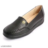 Black leather 126BLACK women's loafer shoe with perforations and beige lining.