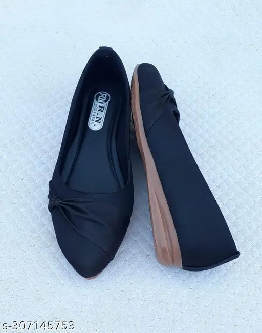 Women's black PU ballerinas, slip-on style, embellished footwear in black color on display