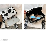 Black leather women's sling crossbody bag with adjustable strap