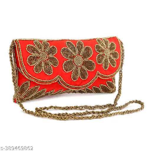 Red handmade embroidered clutch with a floral design and gold trim