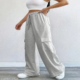 Korean-style women's long joggers in beige color, elastic waistband and pockets, suitable for casual or formal wear