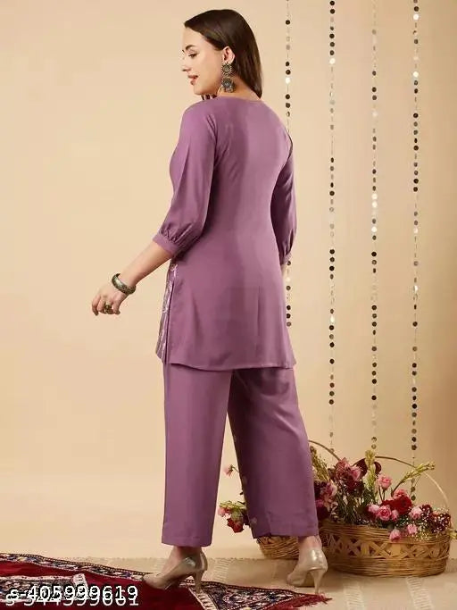 Embroidered net cotton blend kurta set with palazzos, three-quarter sleeves. Single size from India
