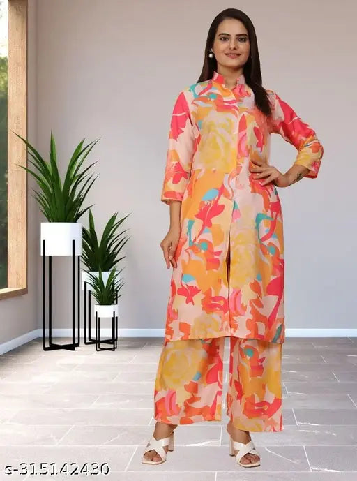 Cream and peach printed rayon co-ord set with three-quarter sleeves, featuring middle cut, mandarin collar, pockets in plazzzo, perfect for every occasion