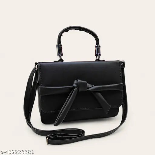 Black leather shoulder bag with thin strap and belted closure