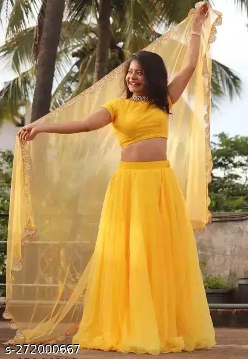 Yellow semi-stitched lehenga choli with net material and satin topwear, lace border net dupatta for parties or functions on mannequin