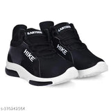 Black sports shoes with white branding, lace-up design, and white soles