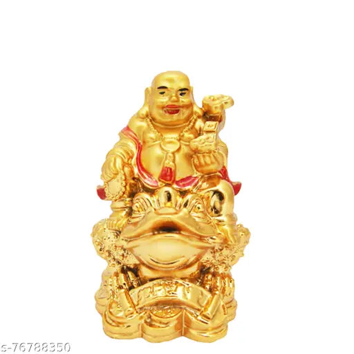 Golden laughing Buddha figurine, posed on a frog coin