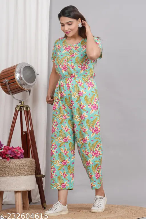 Printed sea green rayon jumpsuit for women with short sleeves, two pockets, button closer - India
