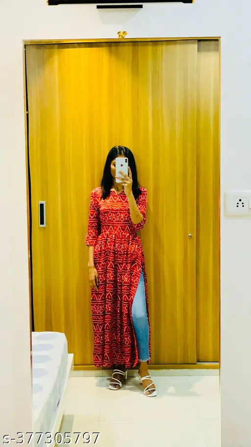 Printed crepe Nayra cut kurti with three-quarter sleeves, vibrant floral print, versatile styling, easy maintenance, and loose fit for various occasions, India origin
