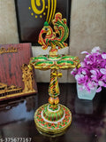Multicolor peacock metal diya stand, handcrafted Indian artifact for home decoration, vibrant showpiece with dimensions: 10cm x 21cm x 10cm